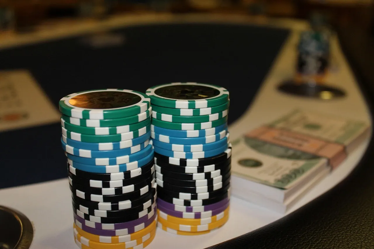 Casino dealer shuffling deck of cards